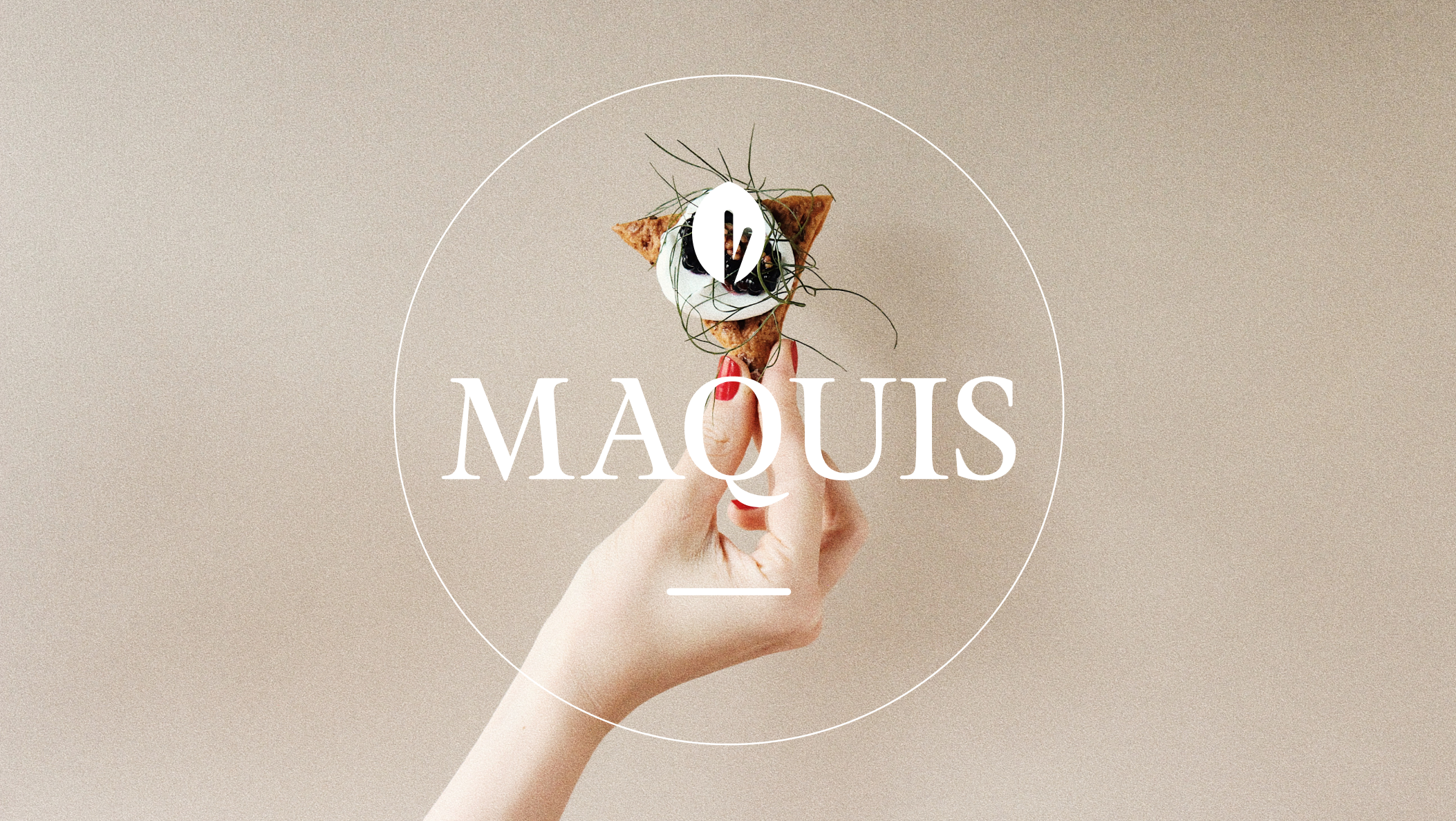 Maquis Logo above a hand holding a triangle shaped food.