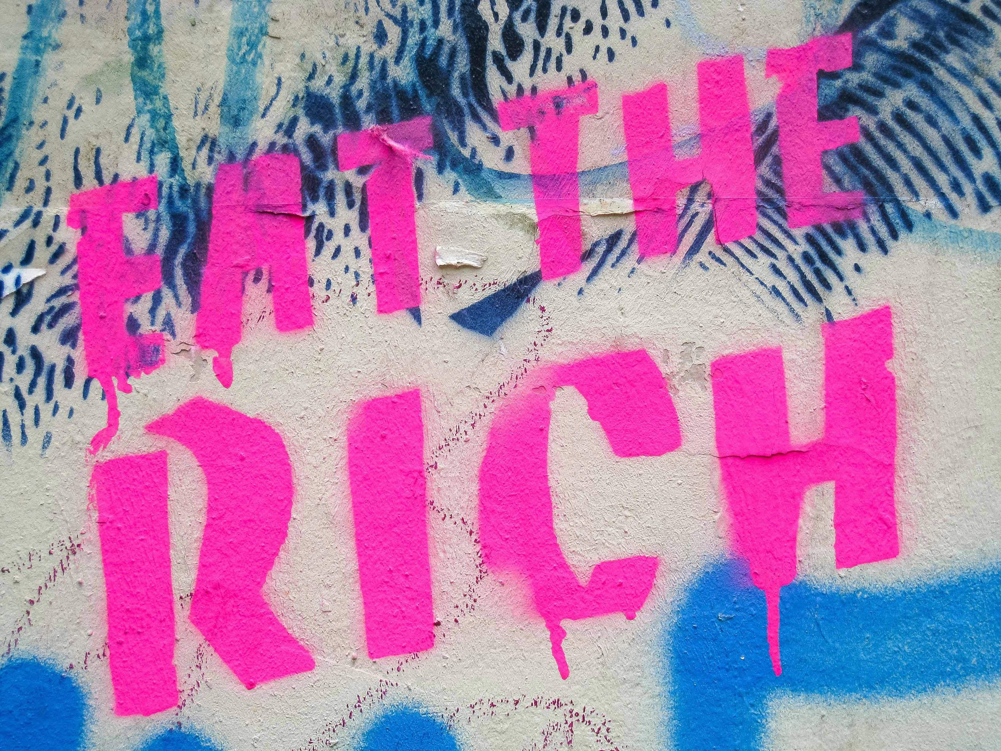 Graffiti saying Eat the Rich