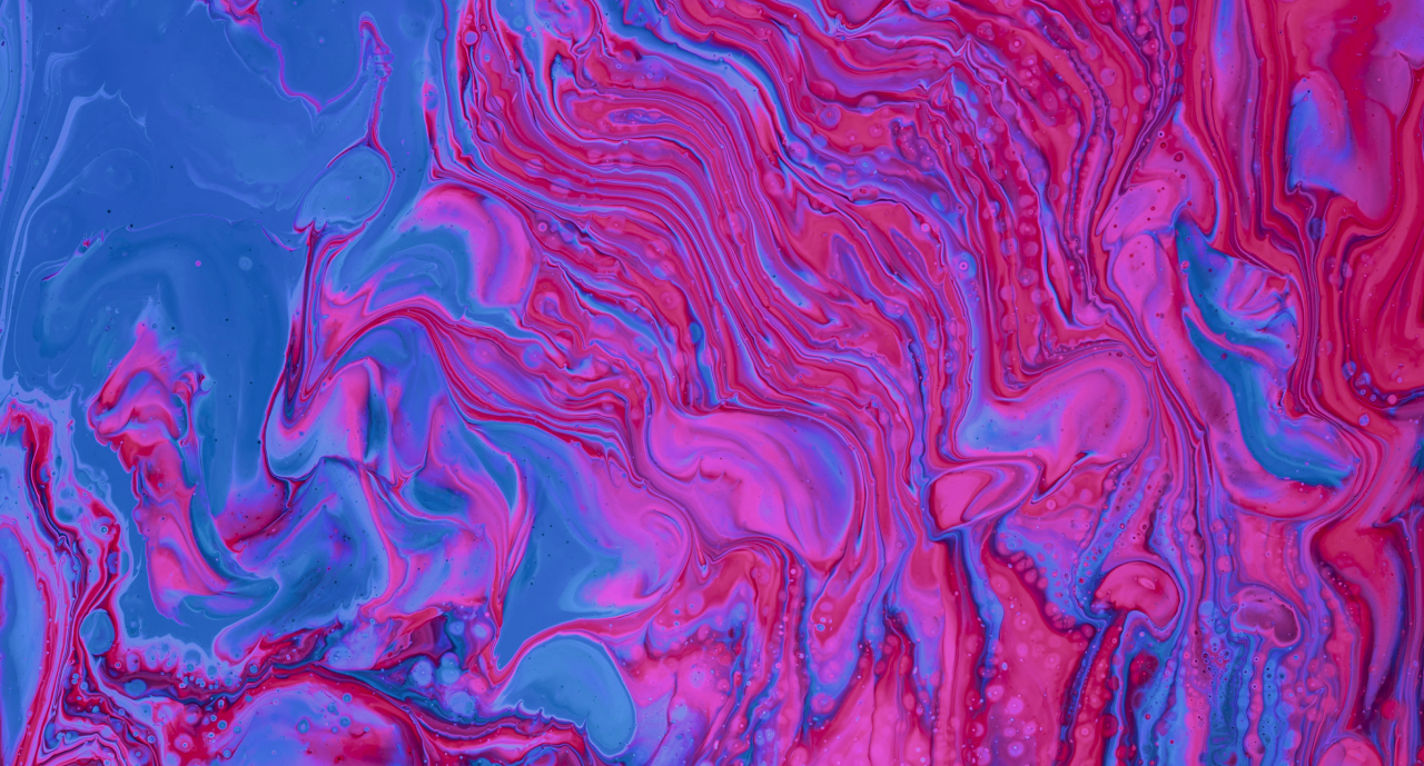 Abstract image with swirling patterns of pink, blue, and purple. The colors are vibrant and blend smoothly with a marbled effect.