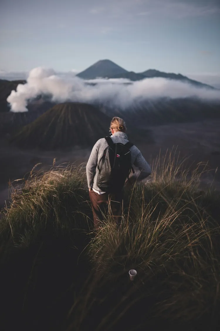 Unsplash image for mobile hands holding package near window natural light